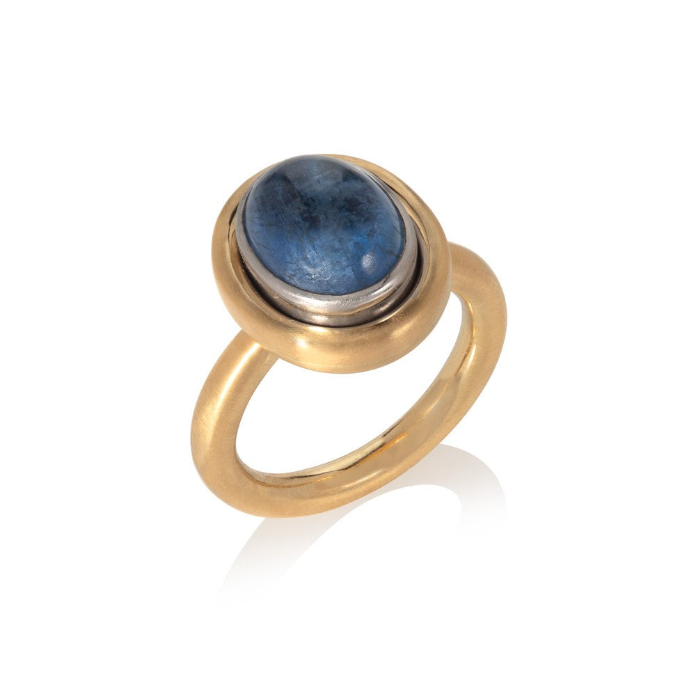 Sapphire cabochon ring set in 18ct white and yellow golds pictured on a white background