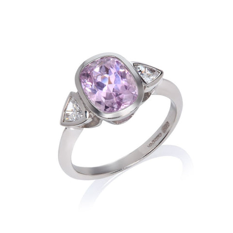 diamond and kunzite white gold ring on a white background