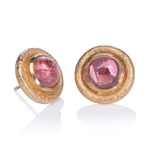 pink tourmaline and yellow gold earrings on a white background