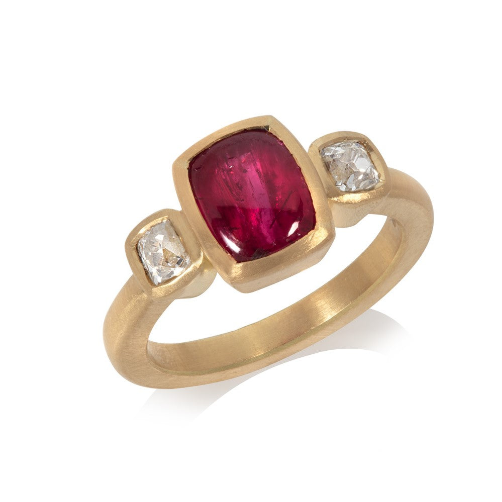 Tabletop ruby and diamond ring set in 18ct yellow gold on white background
