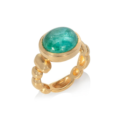 Large oval Paraiba tourmaline cabochon set in yellow gold, with decorative bobble shank