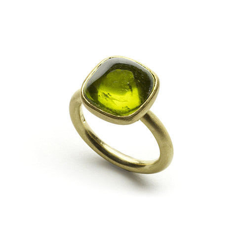 Yellow gold ring set with peridot cabochon in rub-over setting