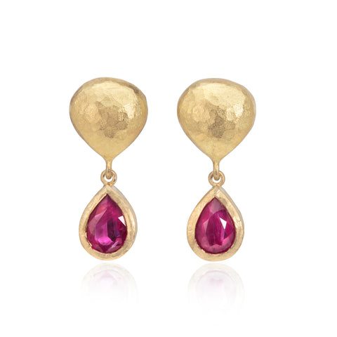 Ruby and 18ct yellow gold drop earrings pictured on a white background