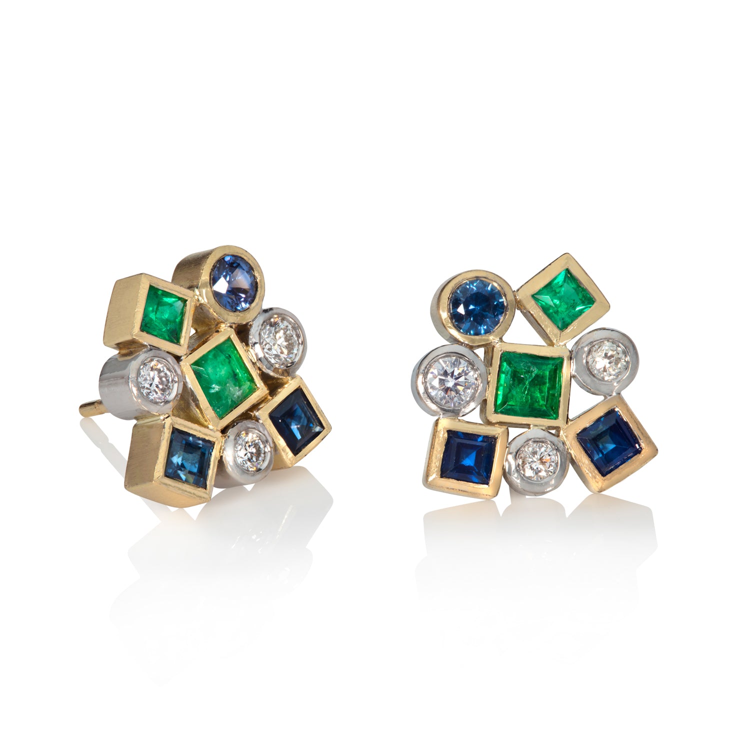 Sapphire, Emerald and diamond cluster earrings on white background