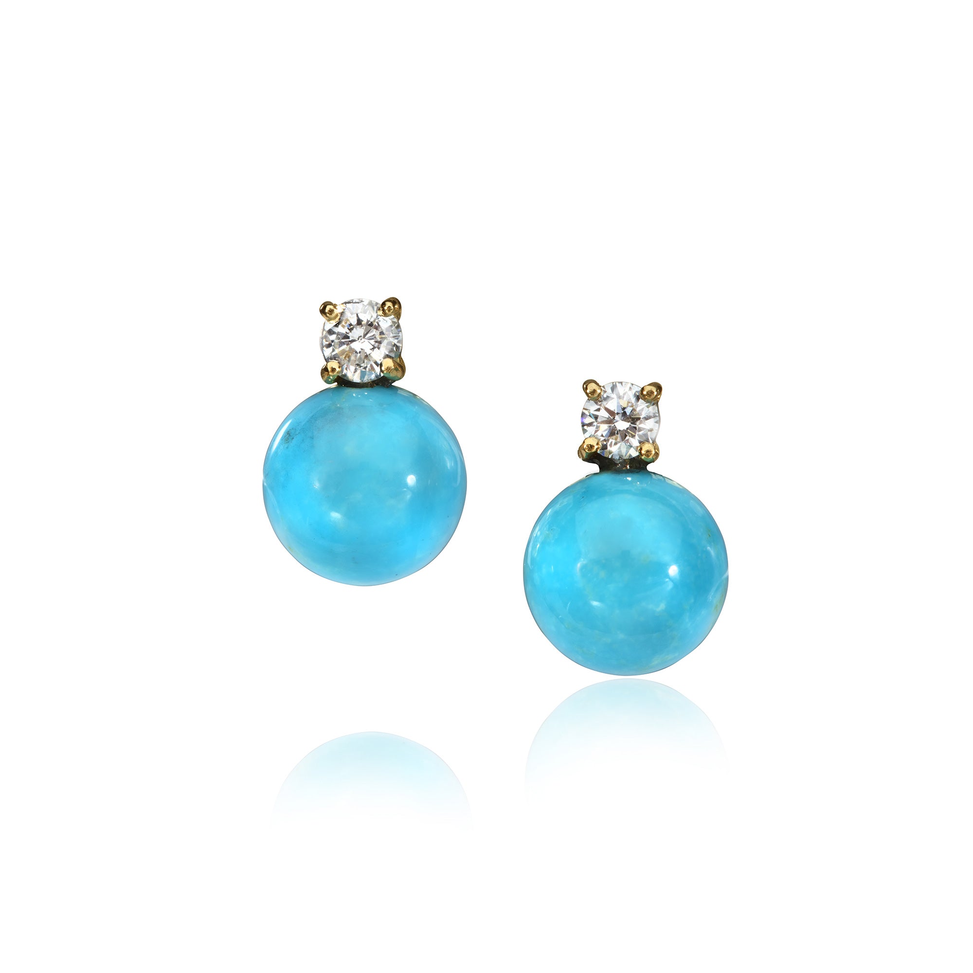 Diamond and Turquoise earrings photographed on a white background