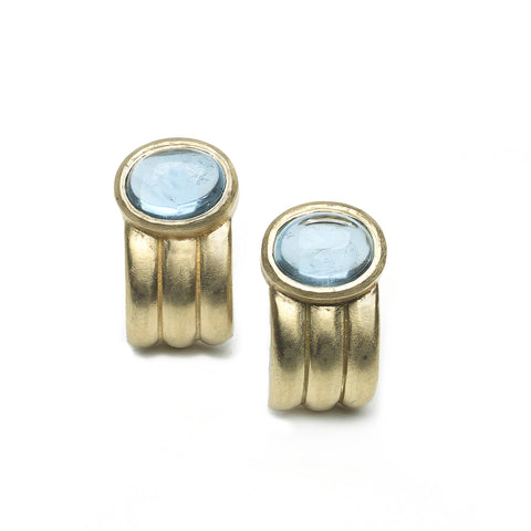 Yellow gold ridged half hoop earrings set with oval aquamarine cabochons