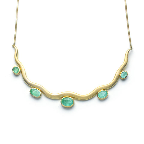 Wavy yellow gold necklace with five oval Paraiba tourmalines in graduated sizes
