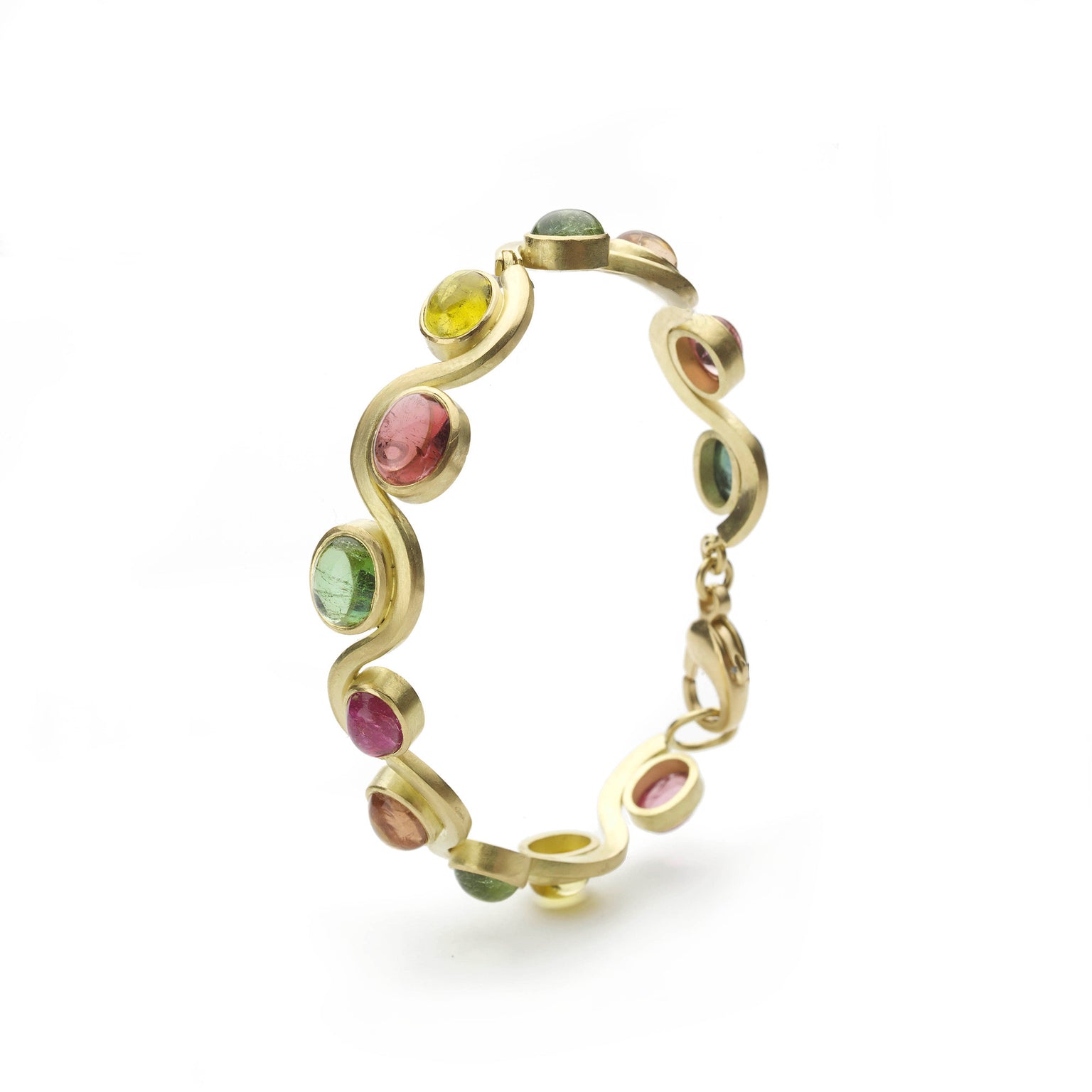Wavy 18ct yellow gold bracelet set with tourmaline cabochons on white background, alternative angle