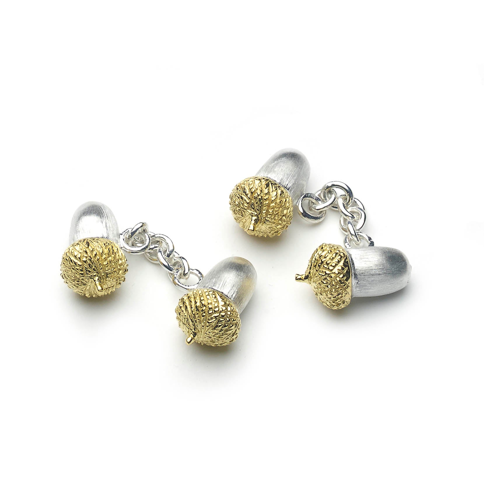 Silver acorn shaped cufflinks with chain link fitting, top of cufflinks are micro-plated with yellow gold, on a white background