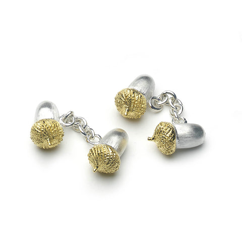 Silver acorn shaped cufflinks with chain link fitting, top of cufflinks are micro-plated with yellow gold, on a white background