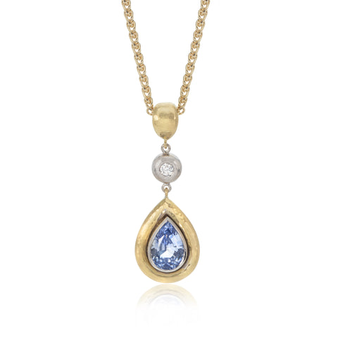 Beaten Texture Pendant with Pear Shaped Sapphire and a Diamond
