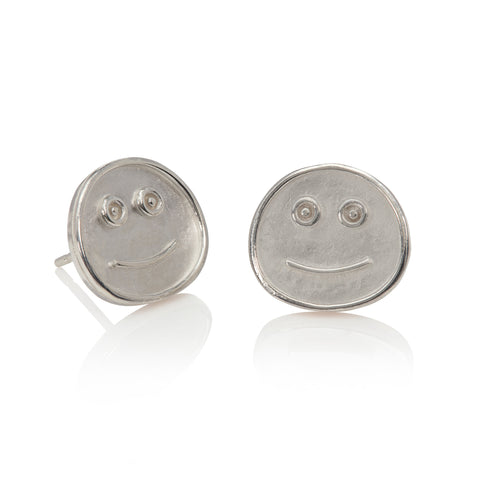 Silver smiley stud earrings pictured on a white background